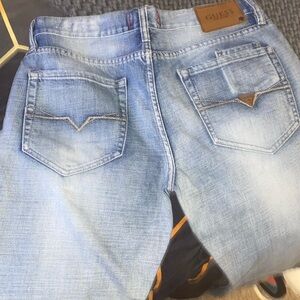 Guess light wash destressed jeans Size 33”w